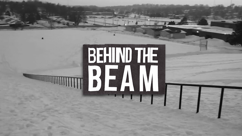 BEHIND THE BEAM